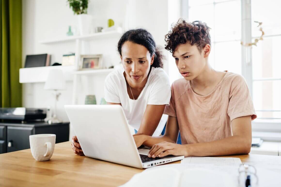 Mom and Teen in front of a laptop