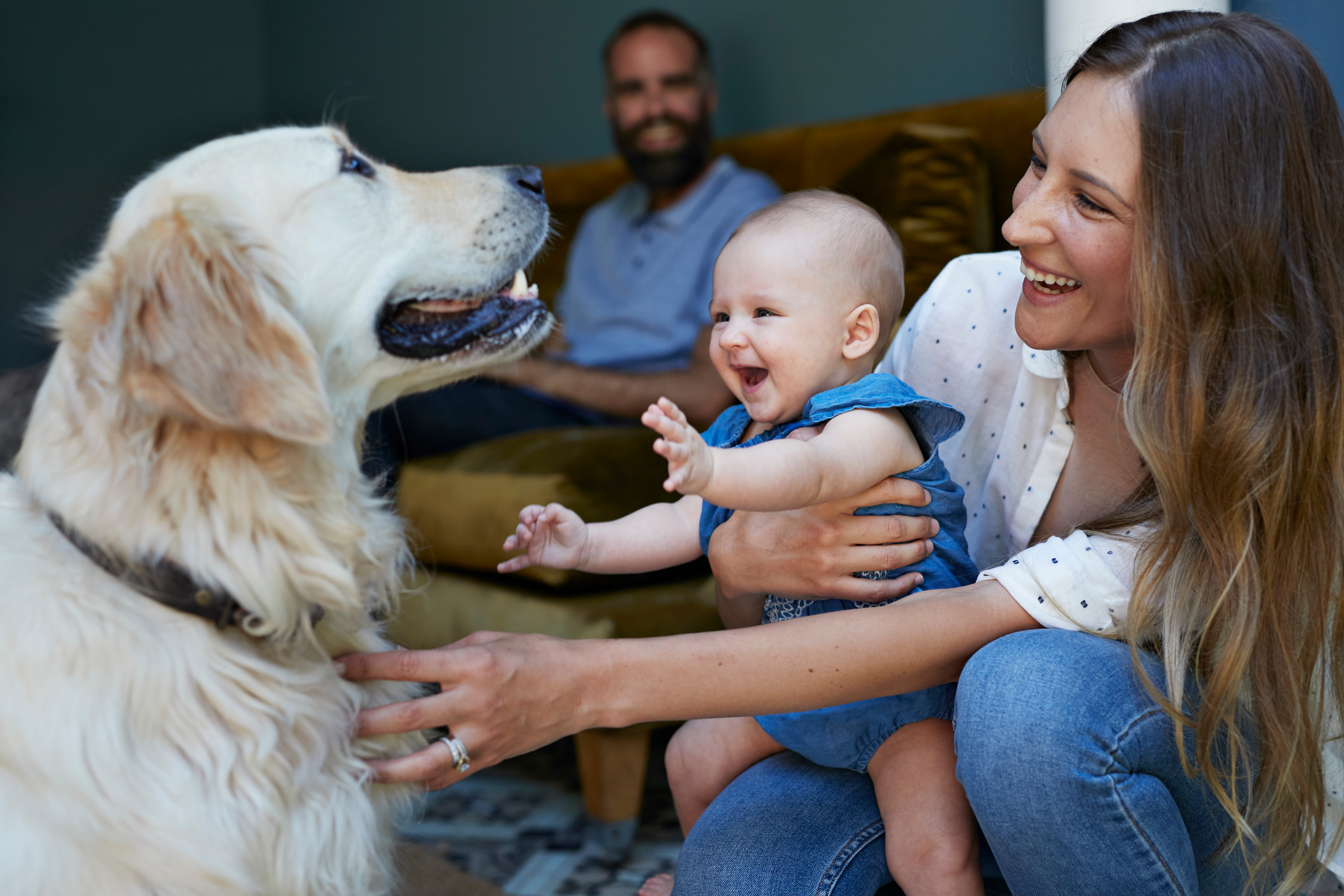 Happy mother and baby playing with baby