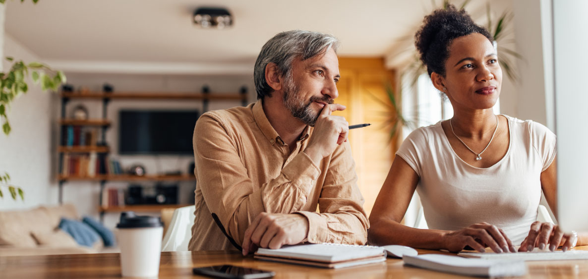 Man and Woman sitting on a table together