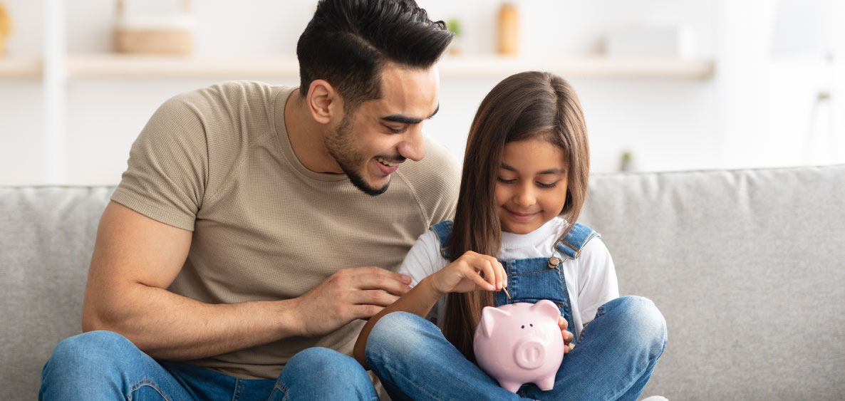 Father gives daughter pink piggy bank
