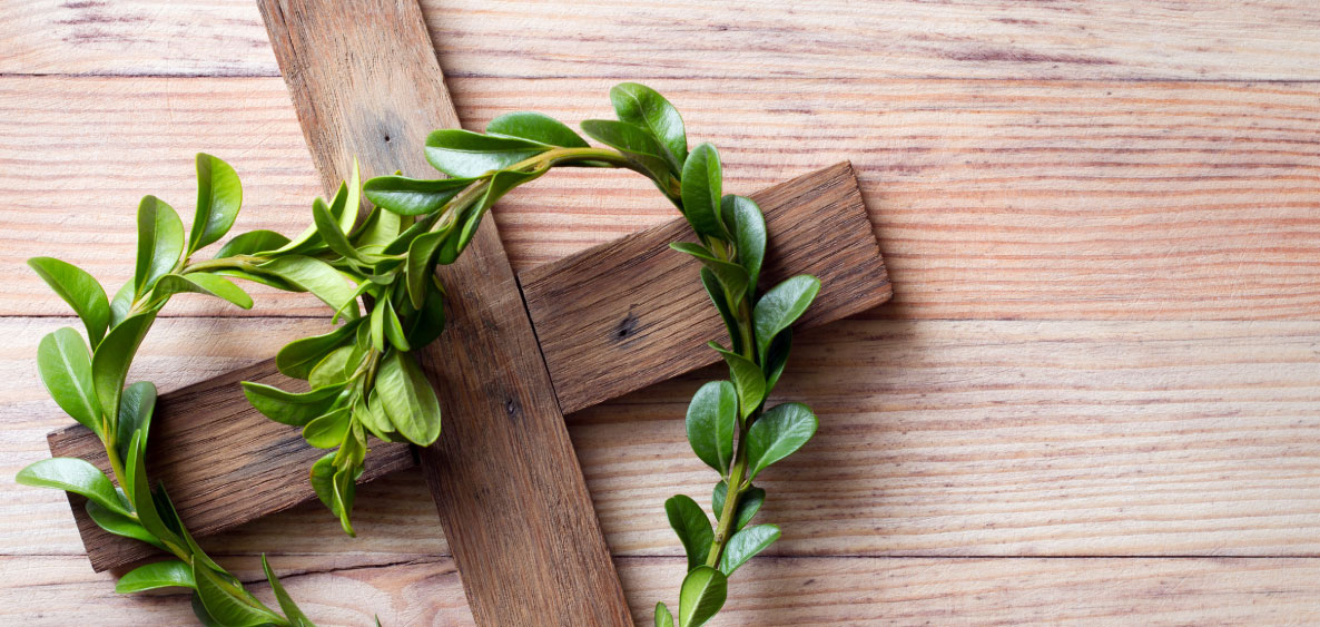 Cross with heart shaped leaves on it