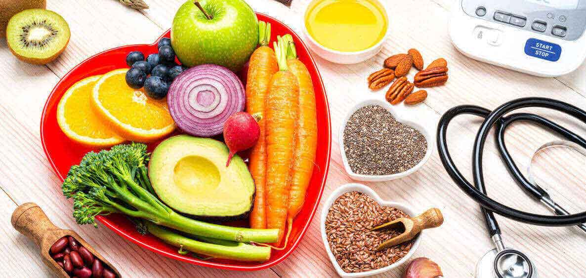 Heart bowls filled with vegetables, fruits, and beans