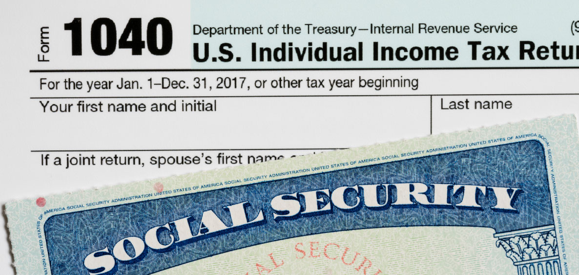 IRS 1040 form and social security card with number cut off