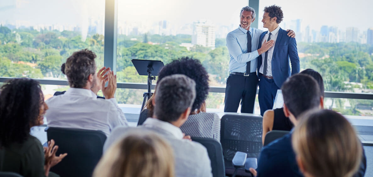 Employee getting recognize in front of other employees