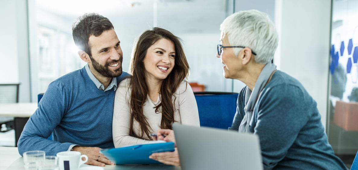 Couple consulting with an agent