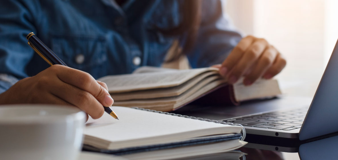 hand writing on a notebook