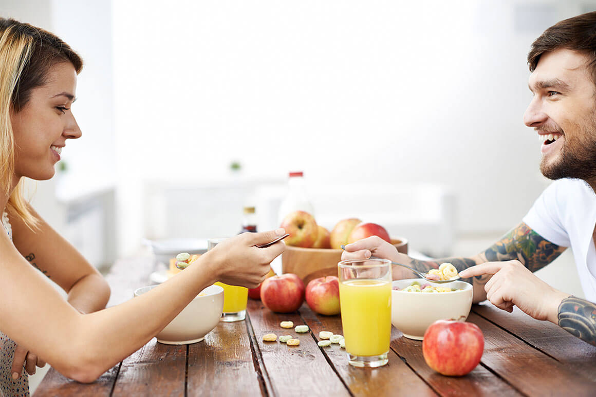 Couple eating breakfast together