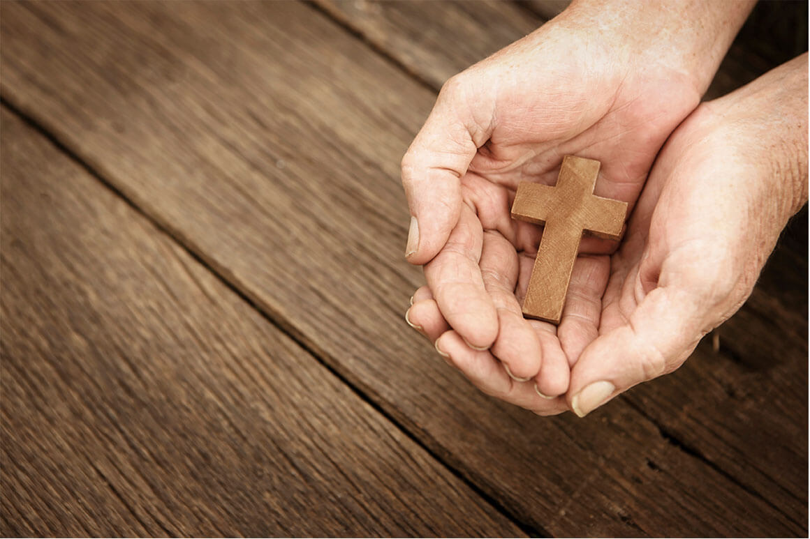 Cross and hand