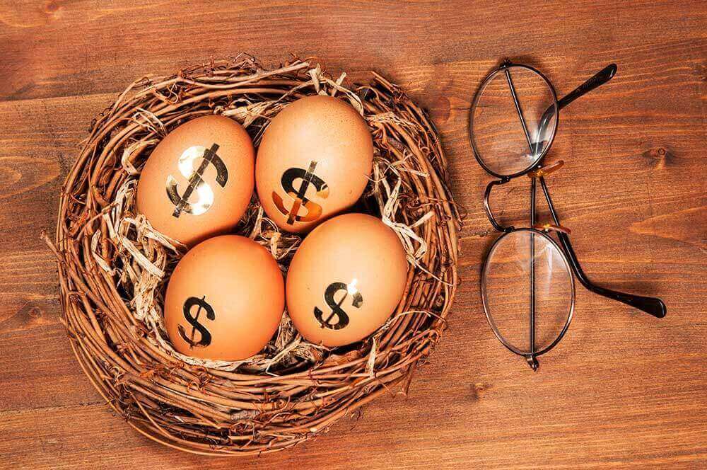 Dollar sign eggs in a nest