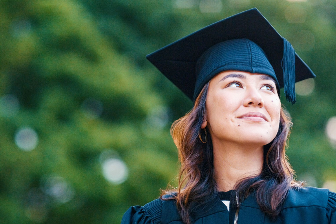 Women in graduation cap and gown.