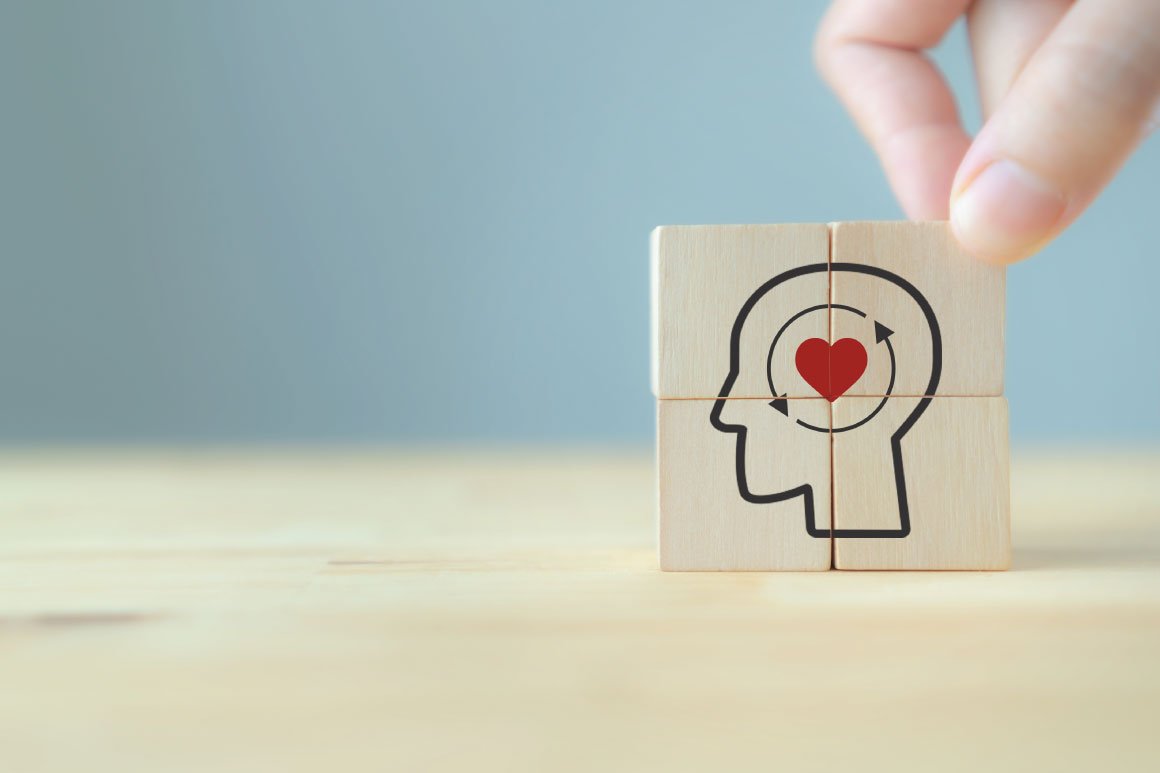 Block with icon of heart inside a brain