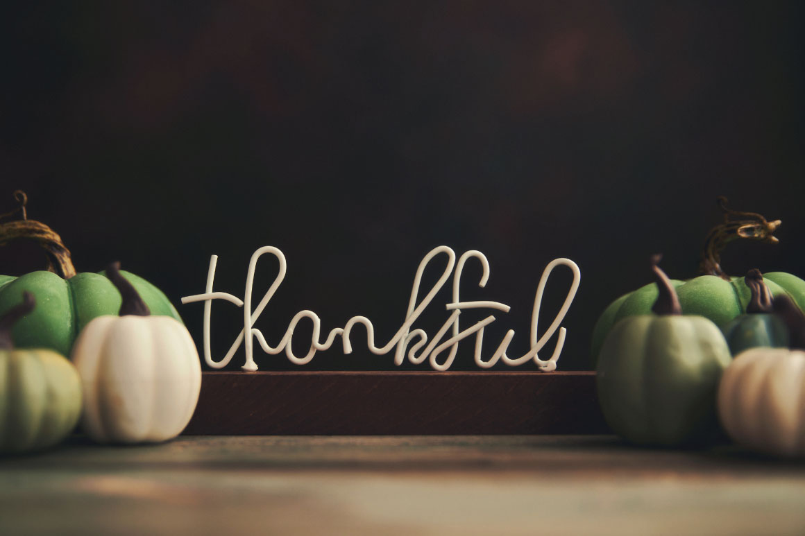 Thankful with green and orange pumpkins