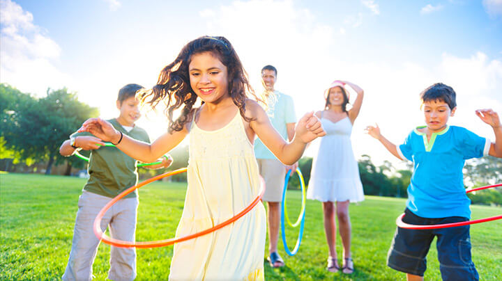 Children playing hula hoop