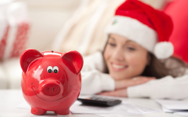 Woman in red with red piggy bank