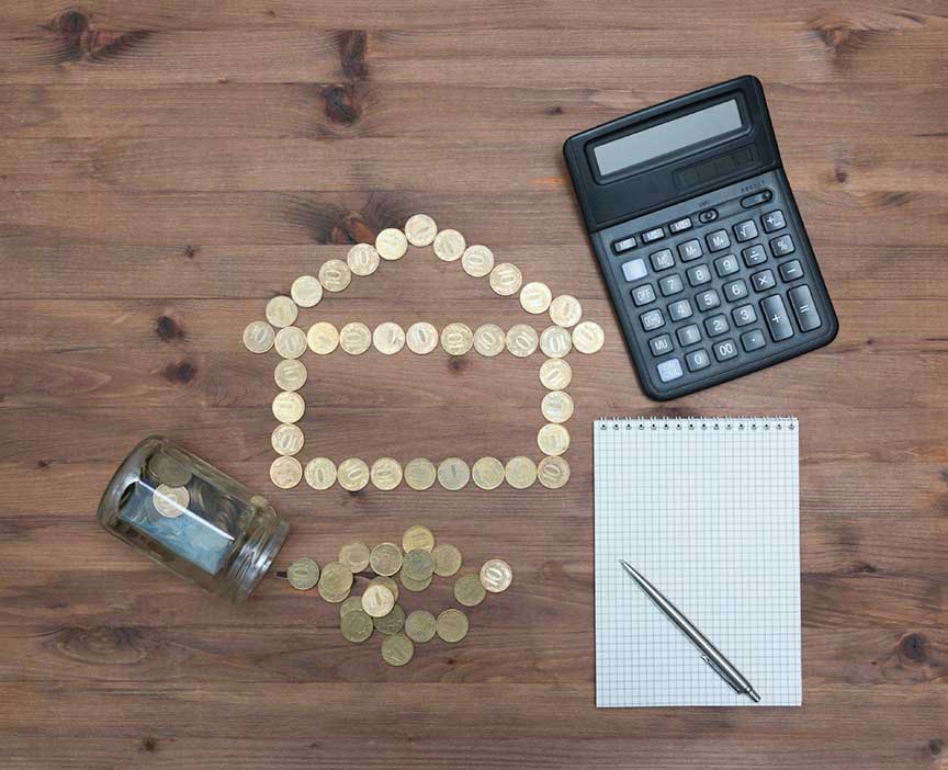 Calculator, coins, and notepad