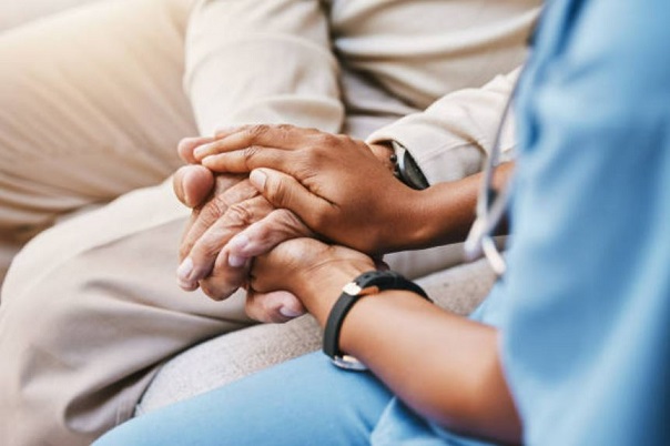 Hands clasping.