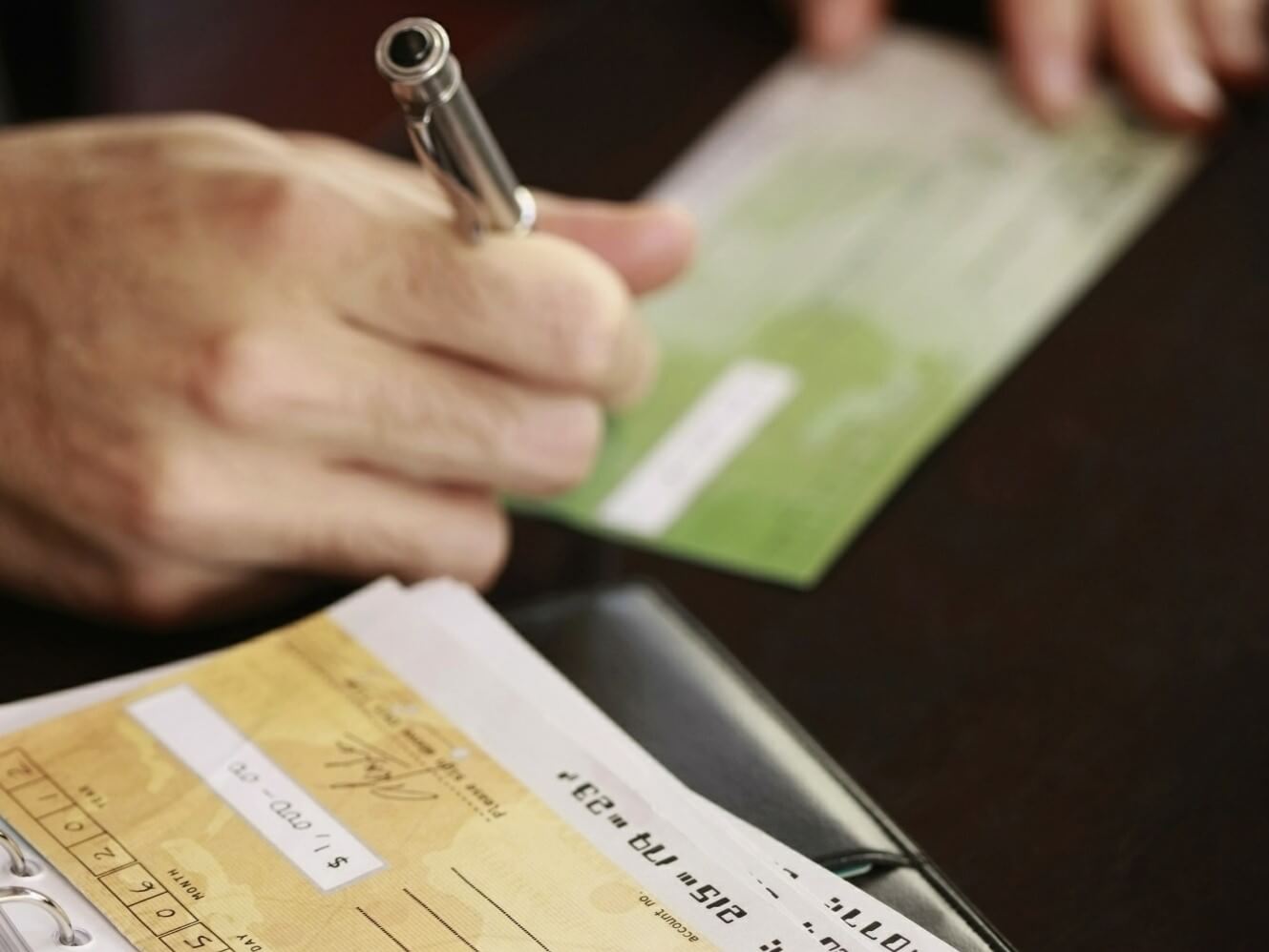 Hand writing a check