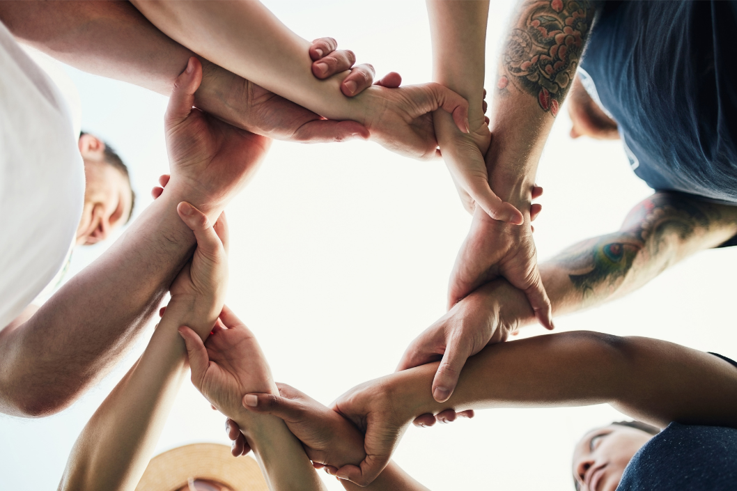 Hands holding in a circle