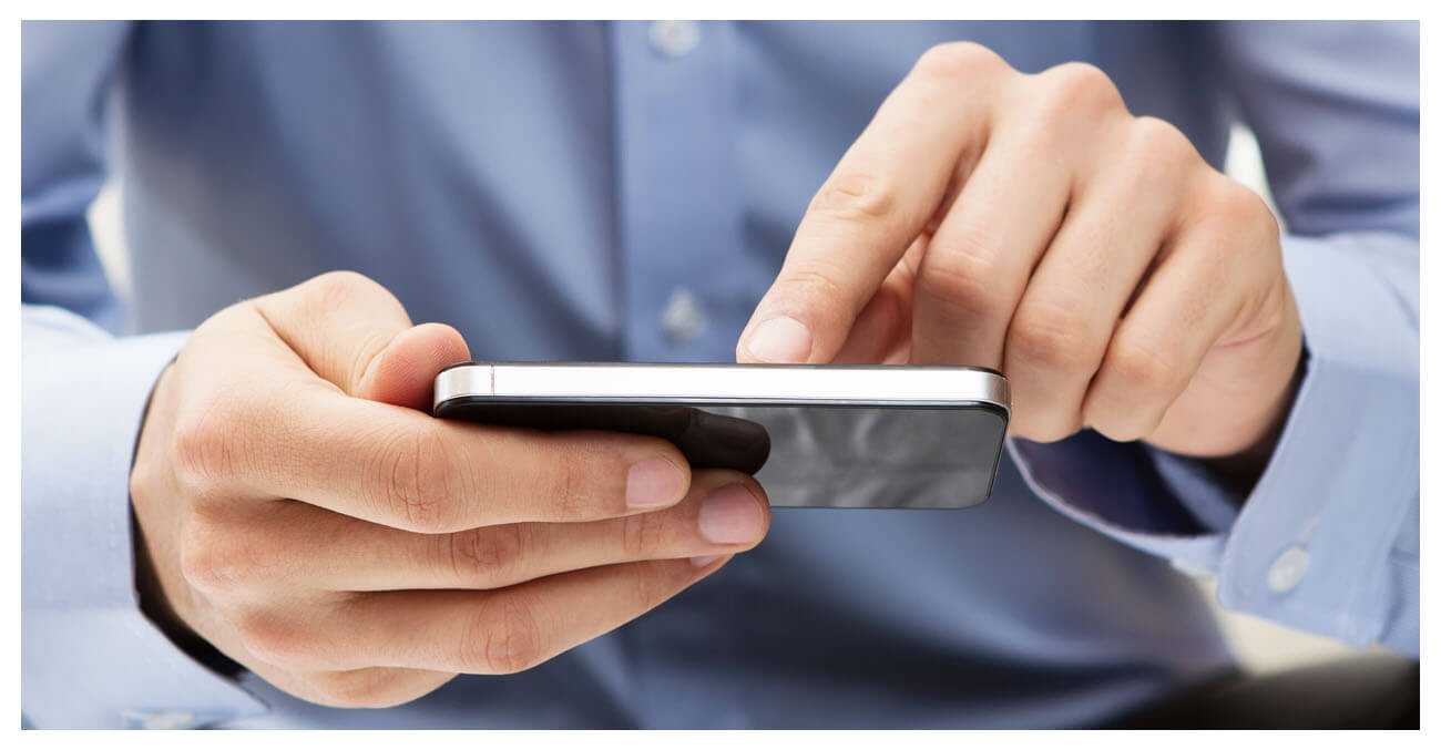 Hand on mobile phone