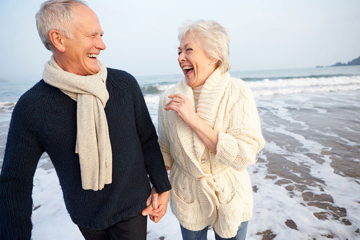 Happy older couple at the beach
