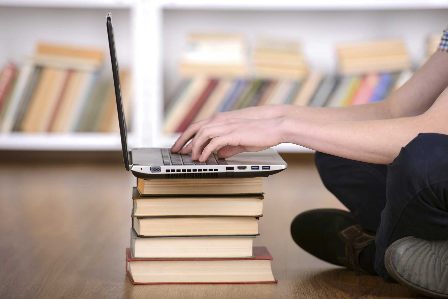 Laptop on top of books
