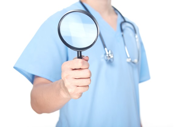 Doctor with magnifying glass