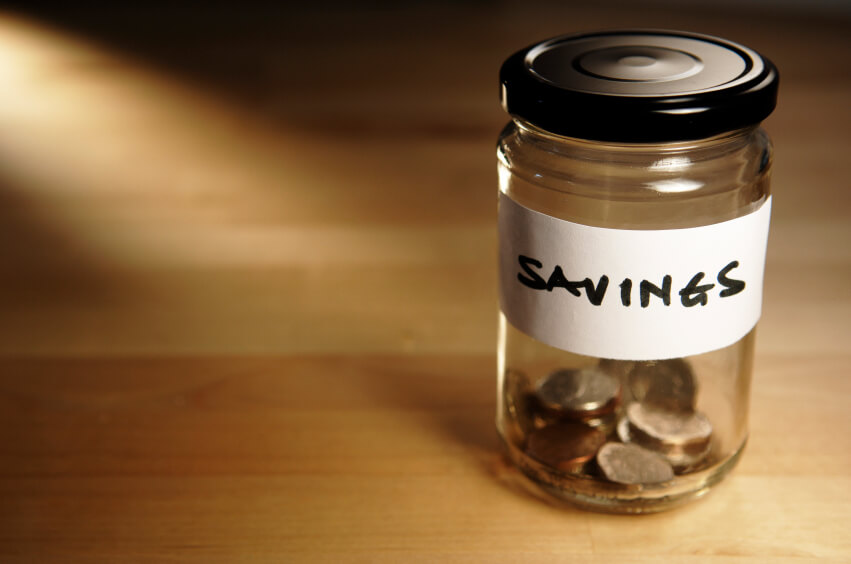 Coins in jar labeled Savings