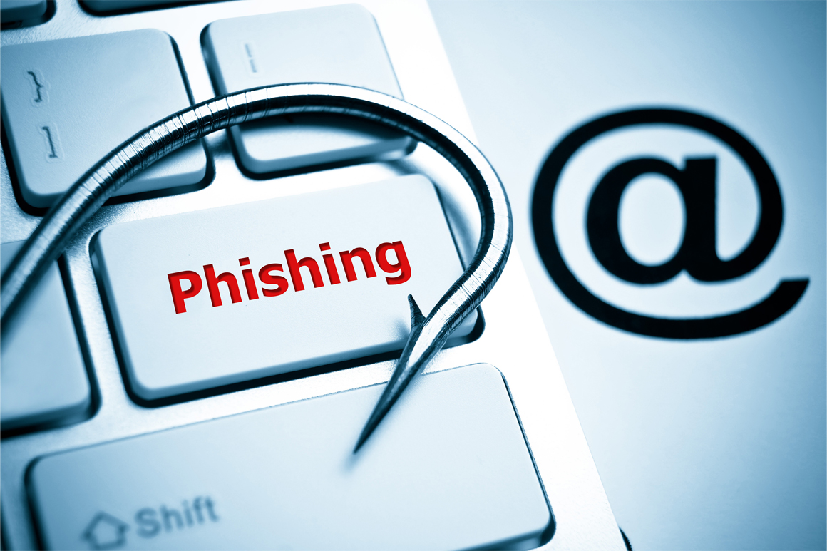 Phishing key on a keyboard with a hook and an @ symbol.