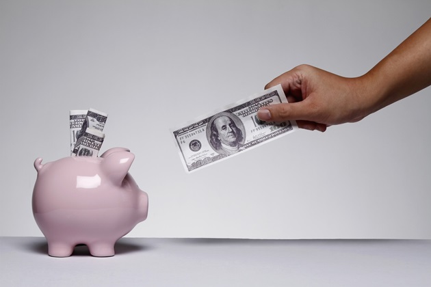 Piggy bank with 100 dollar bills