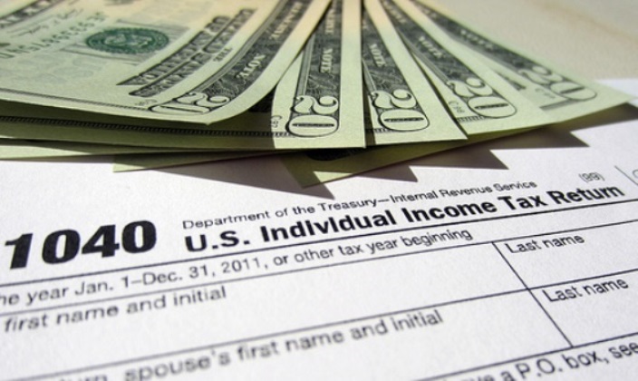 IRS 1040 Form with $20 bills