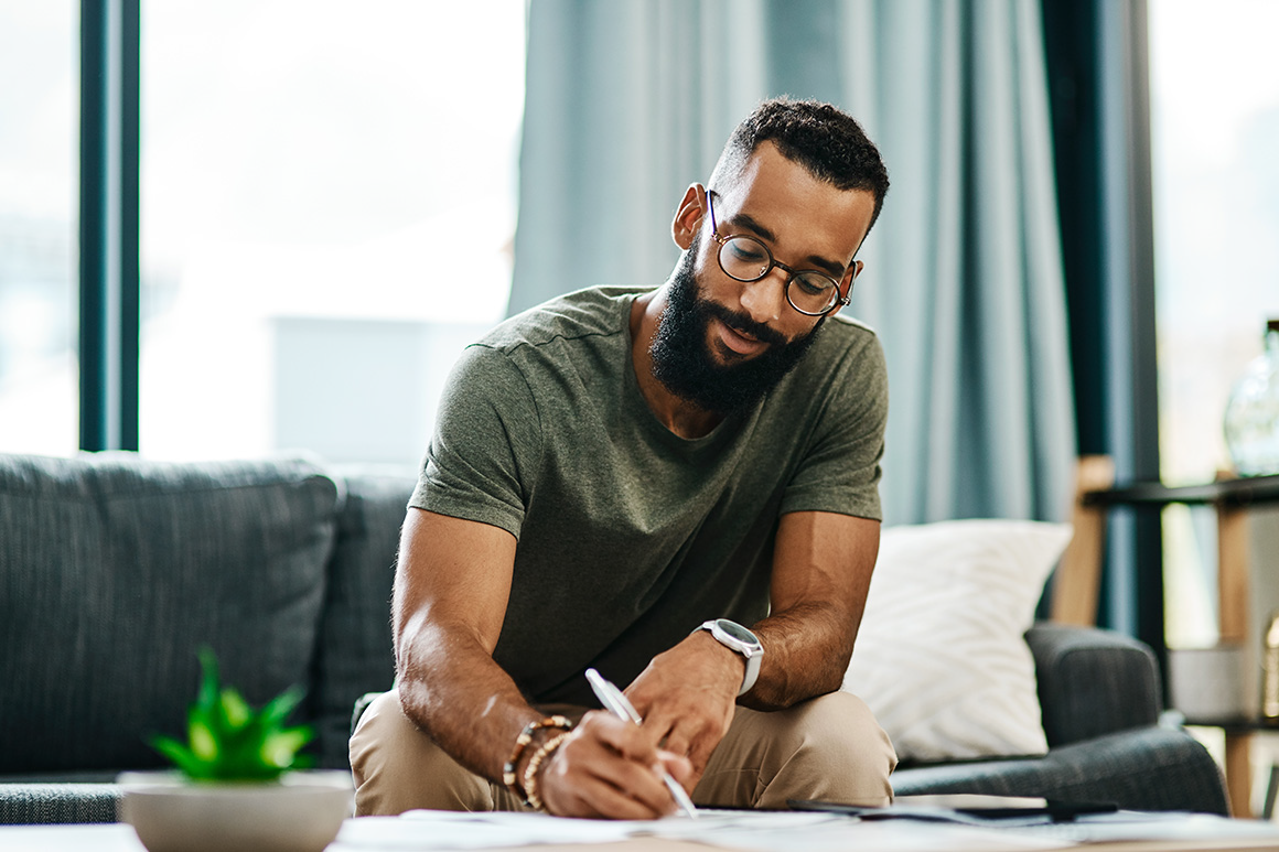 Man writing in his journal